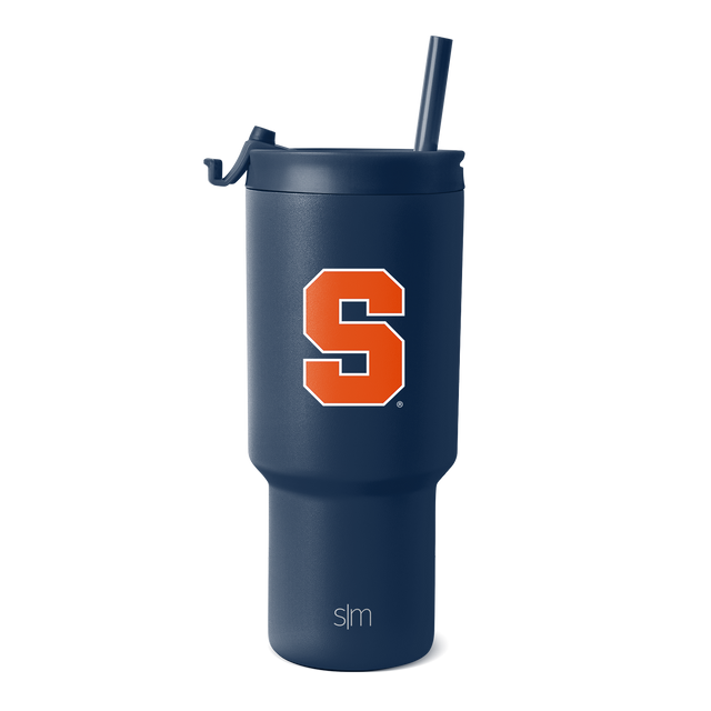 Navy blue insulated tumbler with matching lid, curved handle, and stainless steel straw