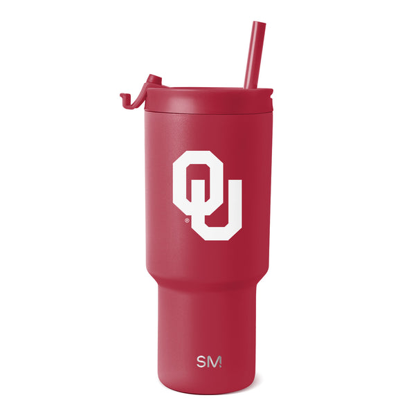 Crimson Oklahoma Trek tumbler with a straw lid