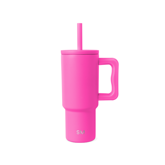 Hot pink reusable drinkware with lid on white background