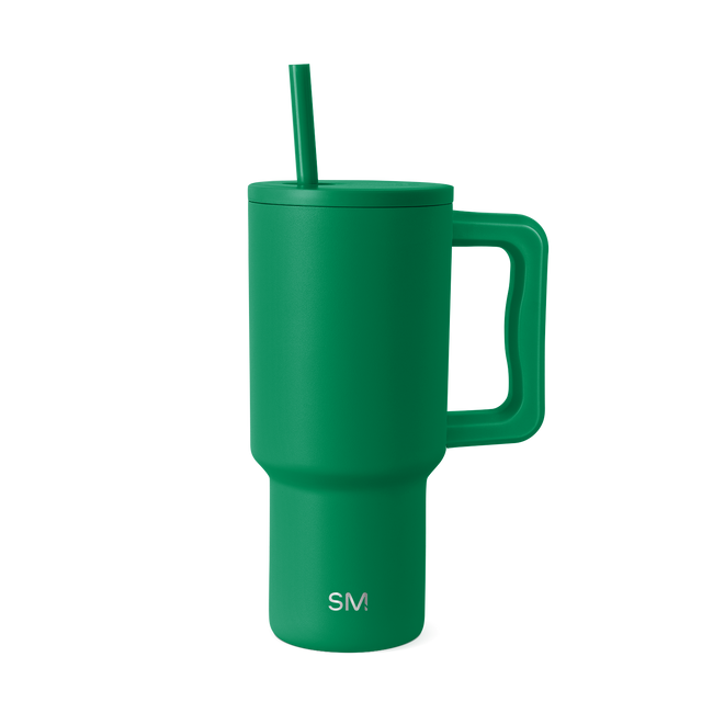 Kelly green insulated tumbler with lid on white background