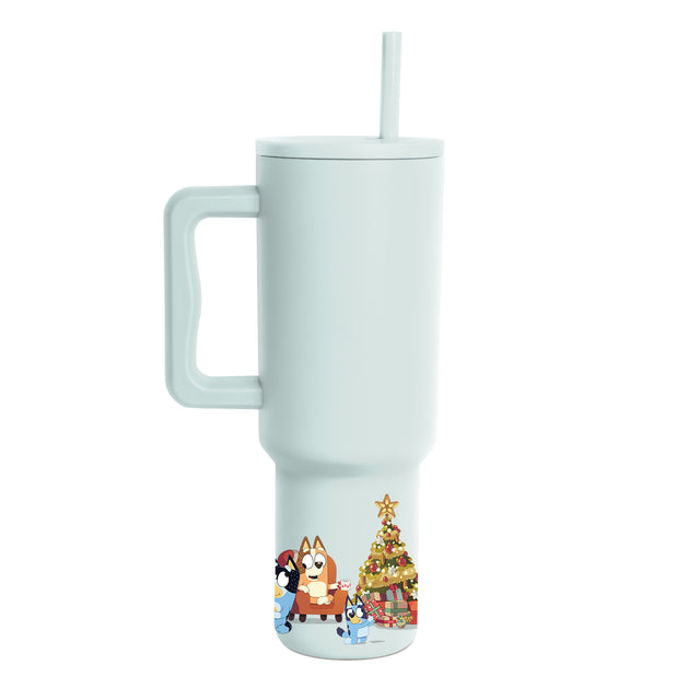 Mint green tumbler with handle, lid, and straw, shown from back view, featuring printed graphic design on pale seafoam body.