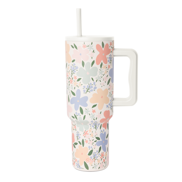 Cream-colored insulated tumbler with botanical floral pattern in soft pink and pale periwinkle pastels