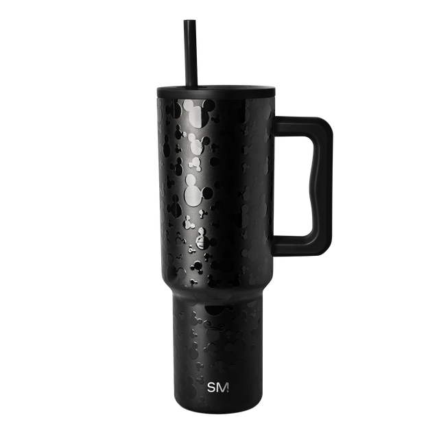 Matte black stainless steel tumbler with handle, cylindrical shape with tapered top, on white background