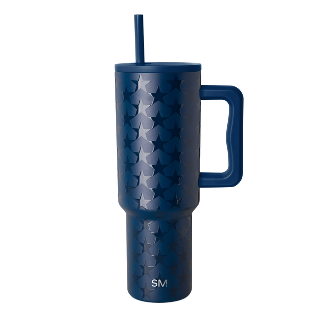 Deep navy blue tumbler with silvery-blue tonal pattern, isolated on white background