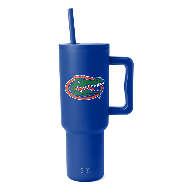 Royal blue insulated tumbler with tapered cylindrical design and wide base, shown on white background