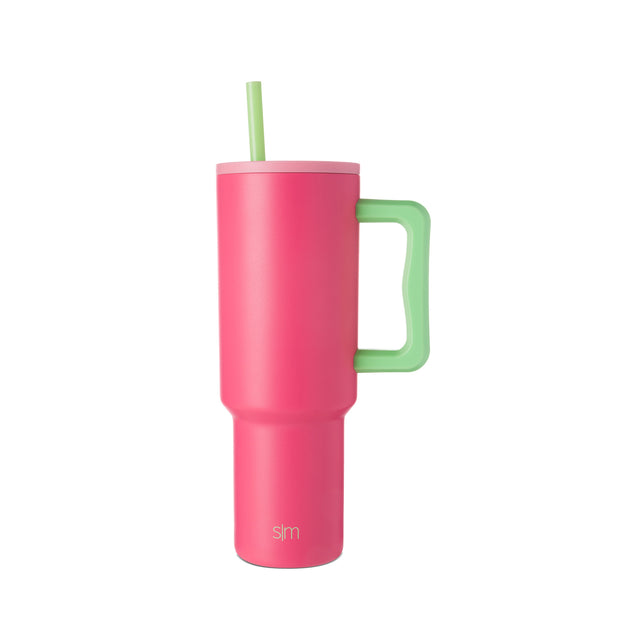 Hot pink tumbler with lime green handle and straw