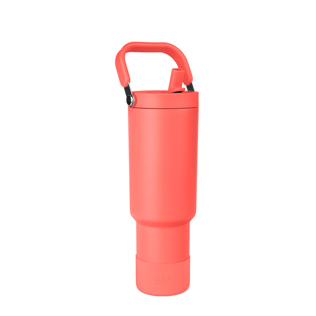 Coral-red insulated water bottle with black handle and carabiner clip on white background
