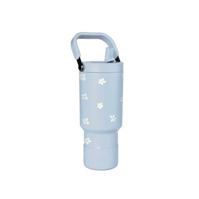 Pale blue glass bottle with white and pale yellow daisy flower motifs scattered across the surface, featuring a calming, gentle aesthetic design.