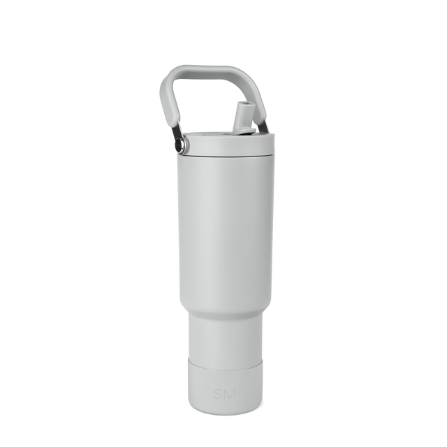 White thermal bottle with gray handle and black metallic hardware at top connection point