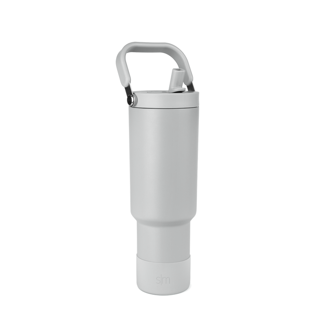 Light gray water bottle with cylindrical body and two-tone handle featuring gray padding and black accents