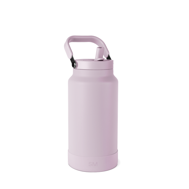 Mauve-pink cylindrical bottle with handle and black lid on white background
