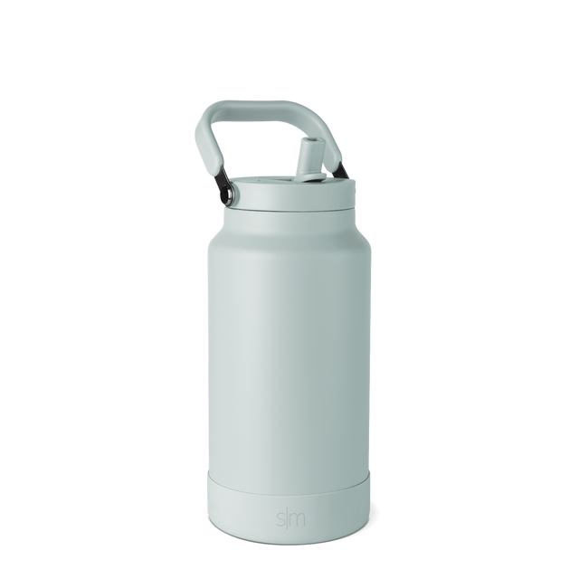 Pale seafoam green insulated water bottle with matching carry handle and base, monochromatic design