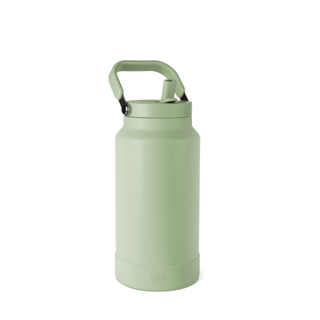 Pale sage green insulated water bottle with cylindrical body, tapered base, and carry handle, photographed against white background.