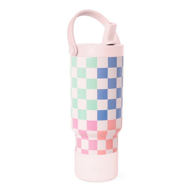 Simple Modern drinkware with pale pink lid and base, featuring a geometric checkerboard pattern with mint green squares on upper section.