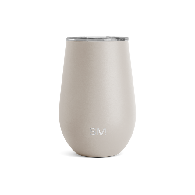Cream-colored insulated tumbler with stainless steel lid on white background. Tapered cylindrical shape with curved sides widening toward middle.