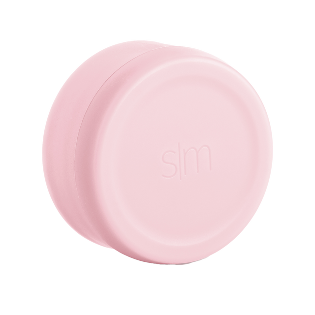 Twist-on lid in brushed rose gold with soft pink tone against white background
