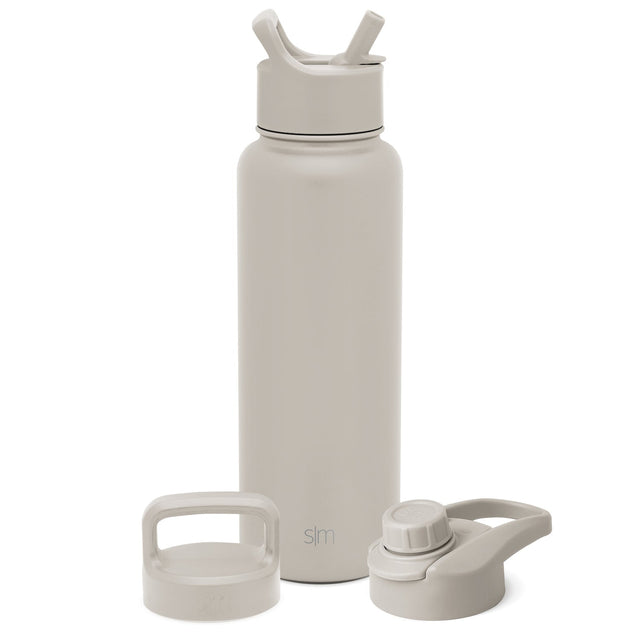 Simple Modern insulated water bottle in cream with three interchangeable lids displayed, including standard cap, straw lid, and flip cap options for versatile hydration.