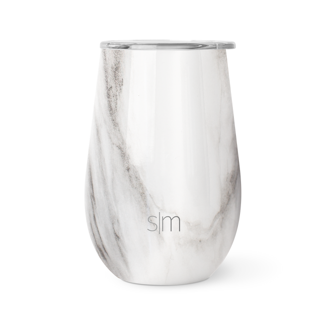 White marble tumbler with light gray and taupe veining pattern flowing diagonally across the surface