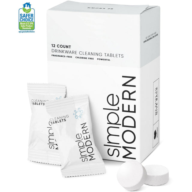 White cleaning tablets in transparent pouches next to white packaging box with black text, displayed against white background with gray shadows